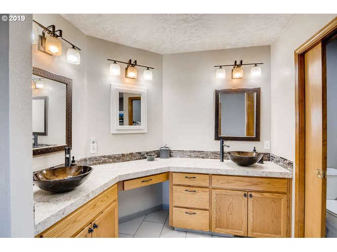13848 Southwest Whitmore Road Hillsboro, OR 97123 - Photo 17 of 29 a bathroom with a sink and a mirror