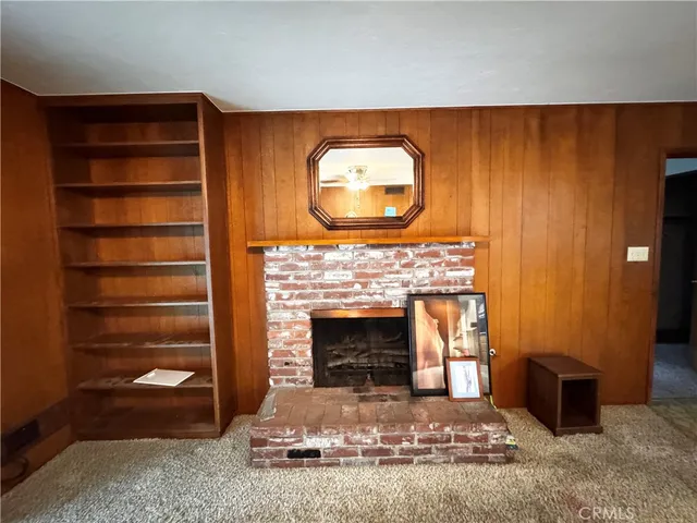 a view of a living room with a flat screen tv