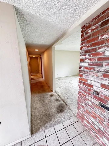 a view of a room with large windows