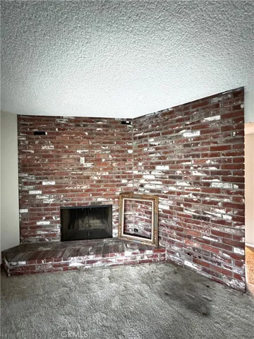a view of a bathroom with sink and mirror
