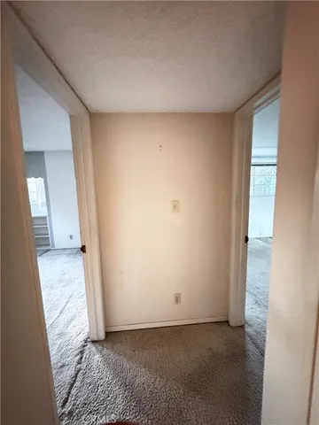 a view of an empty room and fire place