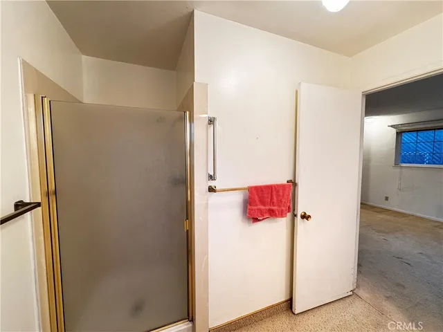 a view of a hallway with a large window