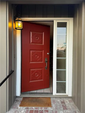 a kitchen with stainless steel appliances kitchen island granite countertop a refrigerator and a stove