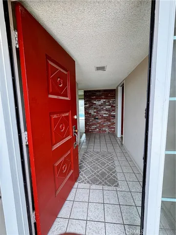 a view of an empty room with a fireplace