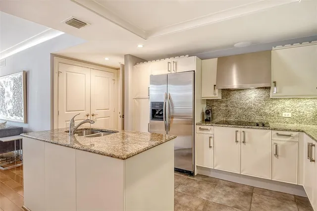 a view of a dining room with a table and chairs