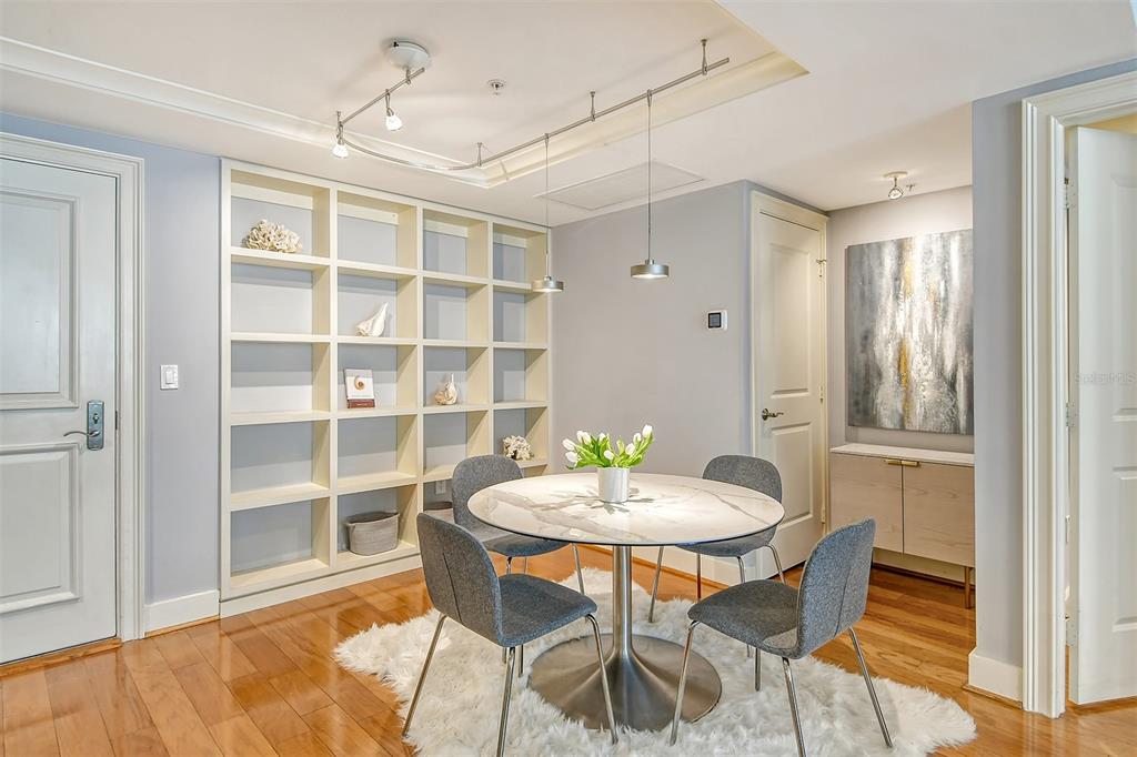 1350 Main Street, Unit 903 Sarasota, FL 34236 - Photo 20 of 71 a view of a dining room with a table and chairs