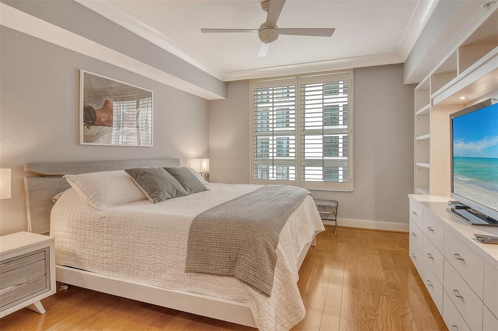 1350 Main Street, Unit 903 Sarasota, FL 34236 - Photo 21 of 71 a spacious bedroom with a bed and a flat screen tv