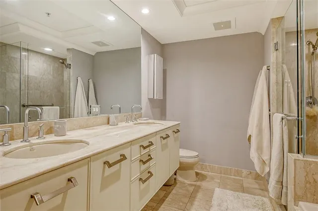 a bedroom with a bed and cupboard