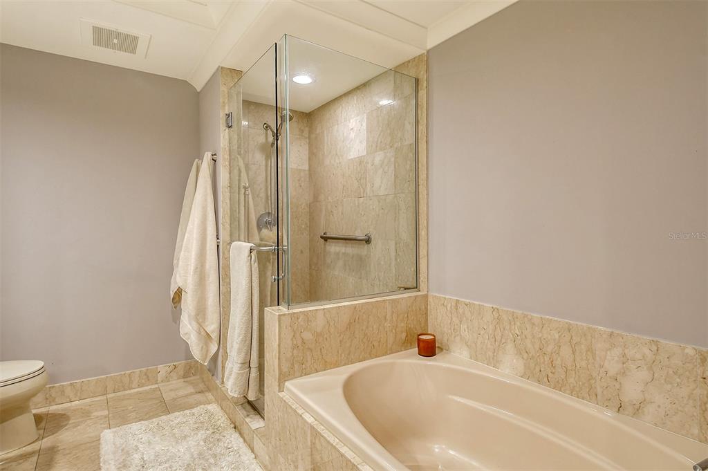 1350 Main Street, Unit 903 Sarasota, FL 34236 - Photo 25 of 71 a bathroom with a tub a toilet and a shower