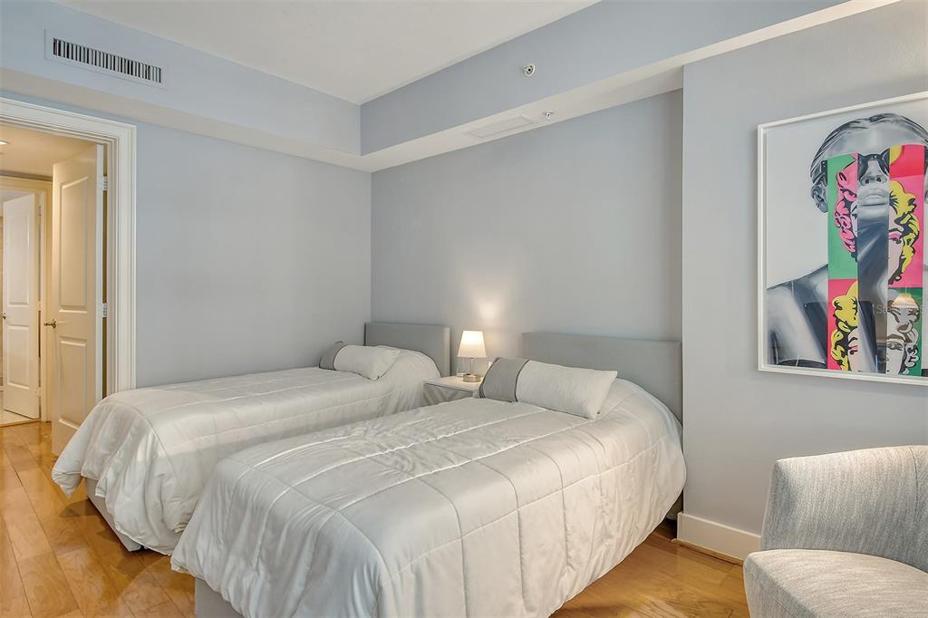 1350 Main Street, Unit 903 Sarasota, FL 34236 - Photo 29 of 71 a bedroom with a bed and cupboard