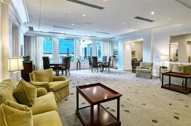 a building view with sitting space and swimming pool