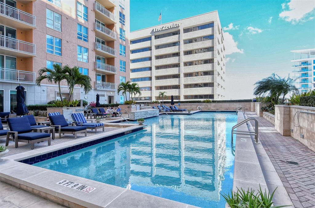 1350 Main Street, Unit 903 Sarasota, FL 34236 - Photo 50 of 71 a view of a swimming pool with outdoor seating