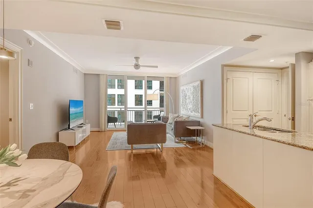 a dining room with furniture and wooden floor