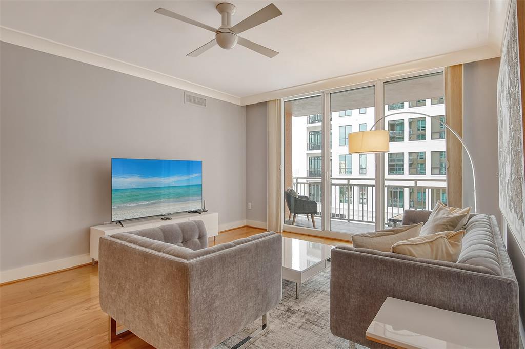 1350 Main Street, Unit 903 Sarasota, FL 34236 - Photo 8 of 71 a living room with furniture and a flat screen tv