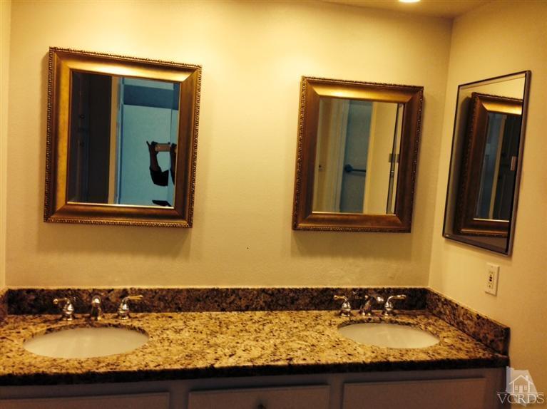 13755 Bear Valley Road Moorpark, CA 93021 - Photo 20 of 29 a bathroom with sink and mirror