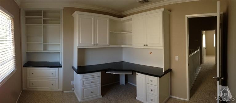 13755 Bear Valley Road Moorpark, CA 93021 - Photo 24 of 29 a kitchen with a white stove and a refrigerator