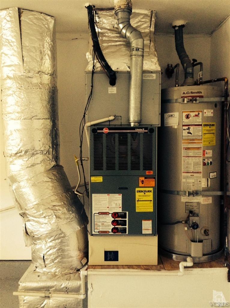 13755 Bear Valley Road Moorpark, CA 93021 - Photo 26 of 29 a kitchen with a stove and a refrigerator