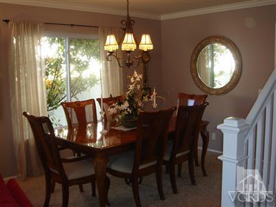 13755 Bear Valley Road Moorpark, CA 93021 - Photo 4 of 29 a dining room with furniture a chandelier and a large window