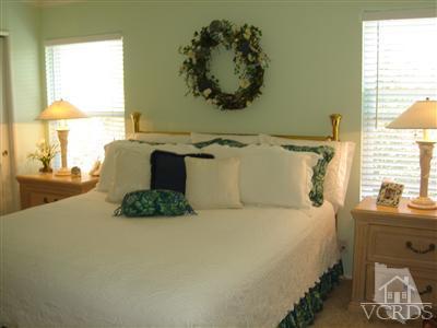 13755 Bear Valley Road Moorpark, CA 93021 - Photo 9 of 29 a bed sitting in a bedroom next to a window
