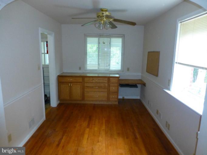 11925 Andrew Street Silver Spring, MD 20902 - Photo 15 of 23 a room with wooden floors and windows