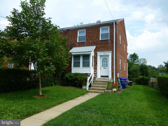 11925 Andrew Street Silver Spring, MD 20902 - Photo 23 of 23 a front view of a house with a yard