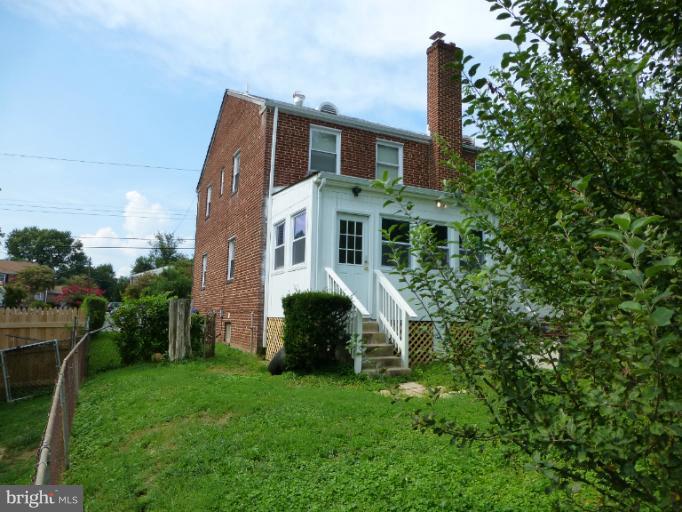 11925 Andrew Street Silver Spring, MD 20902 - Photo 6 of 23 a view of a house with backyard and garden