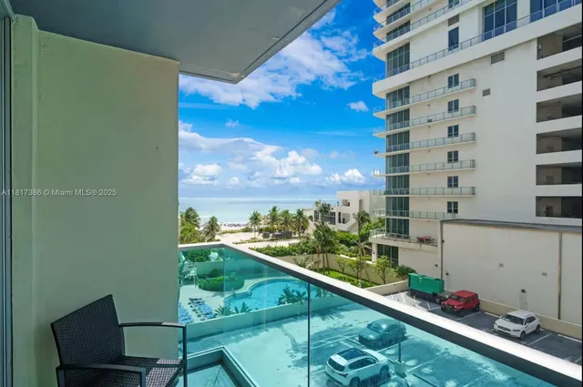 a view of a balcony and chairs