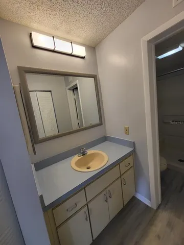 a view of hallway with wooden floor