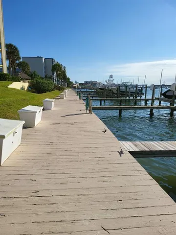 a view of a two chairs in the garden
