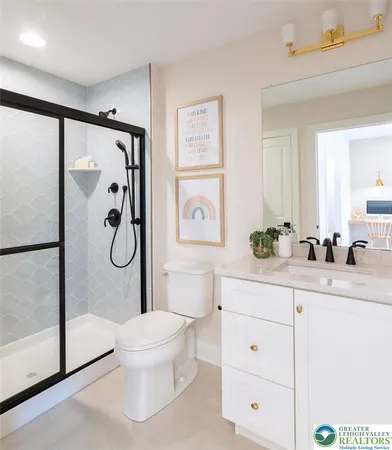 a bedroom with a bed and dresser with mirror