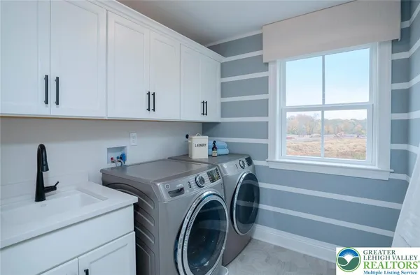 a bedroom with a bed next to a window