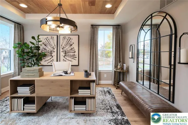 a living room with furniture a chandelier and a chandelier