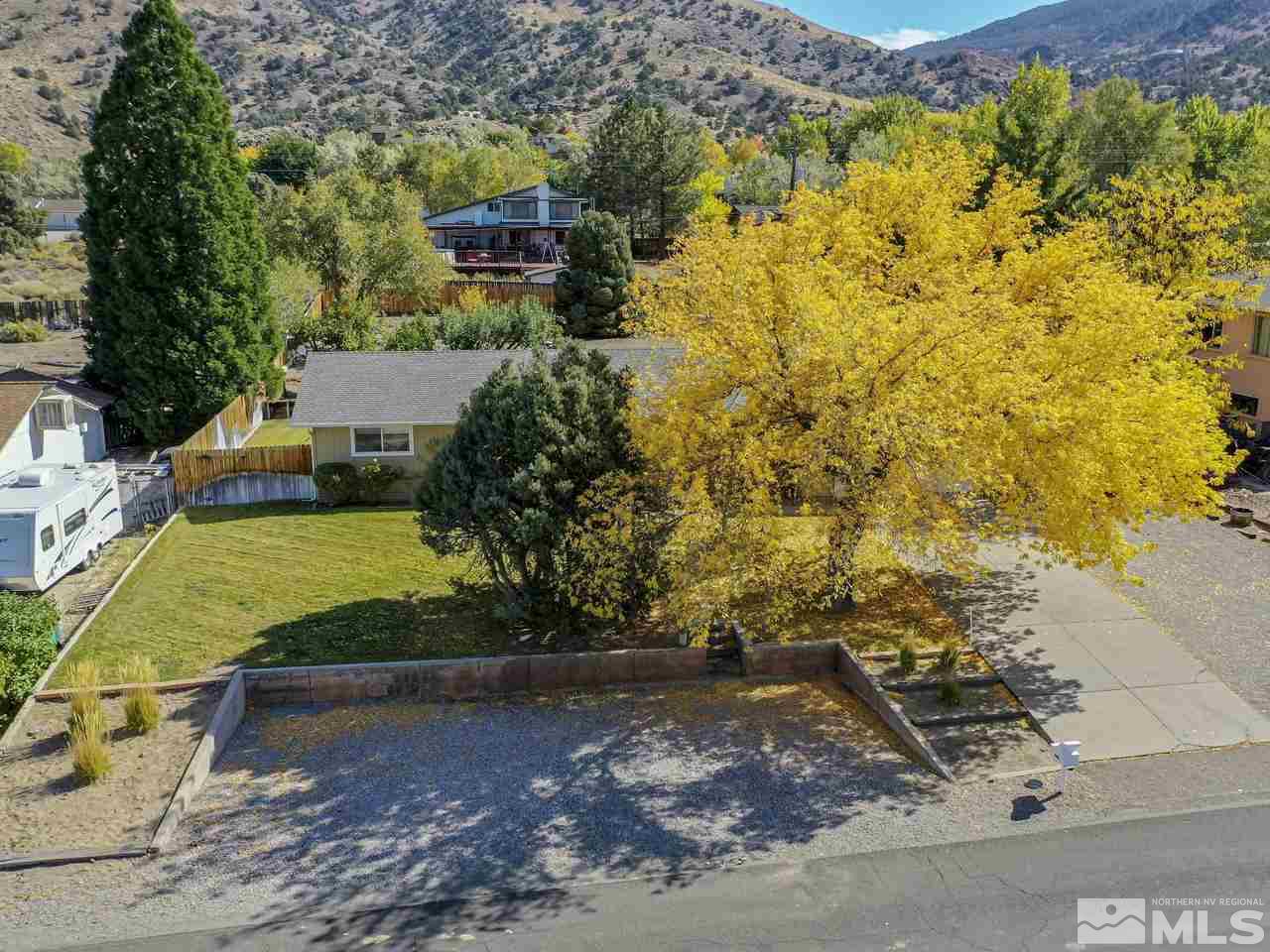13870 Chamy Drive Reno, NV 89521 - Photo 1 of 21 a view of a yard with plants and large trees