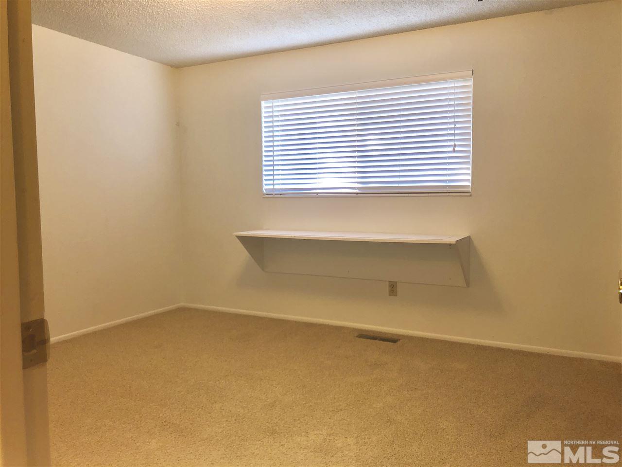 13870 Chamy Drive Reno, NV 89521 - Photo 11 of 21 a view of a room that has a window in it