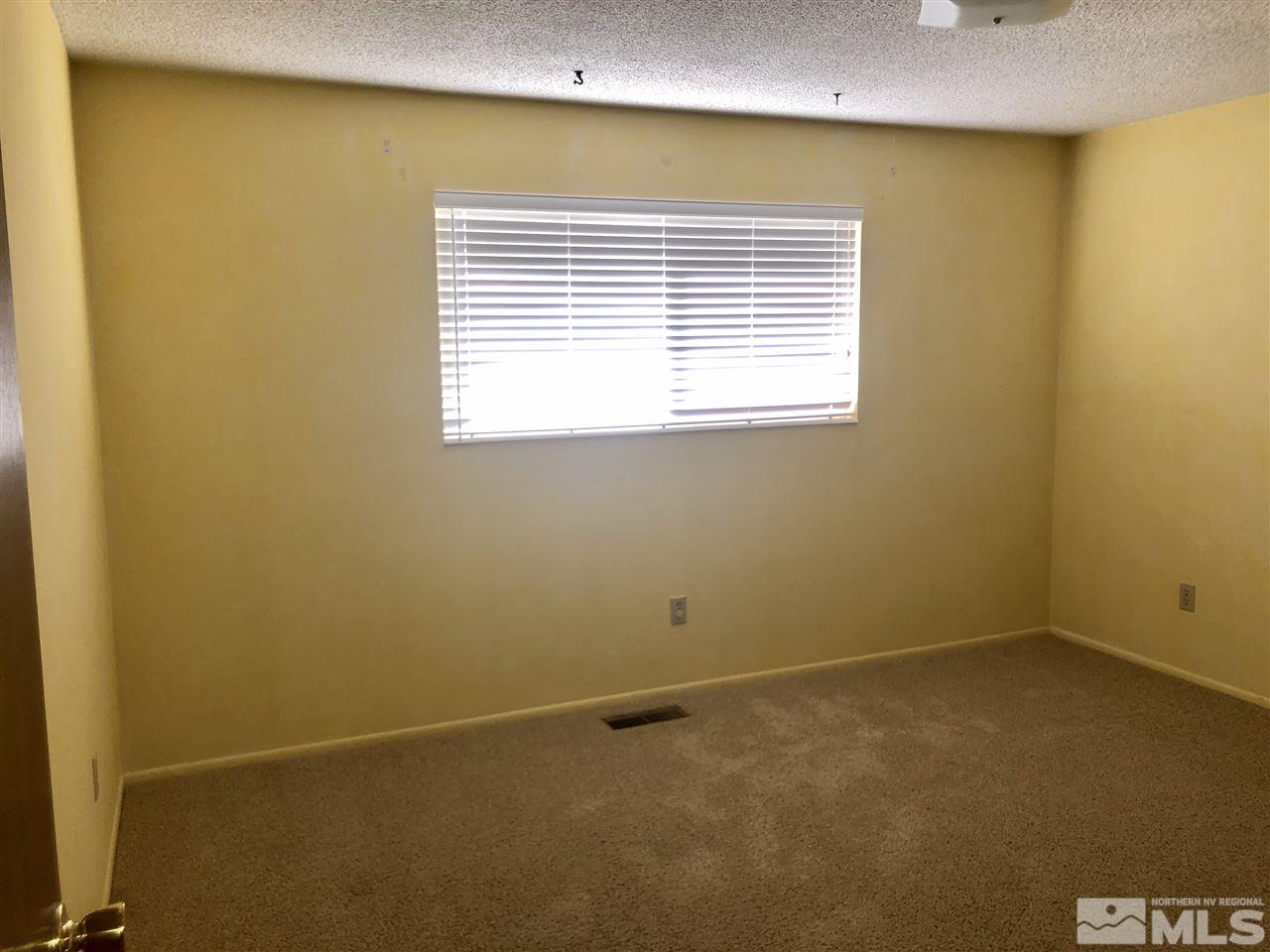 13870 Chamy Drive Reno, NV 89521 - Photo 12 of 21 a view of an empty room with a window