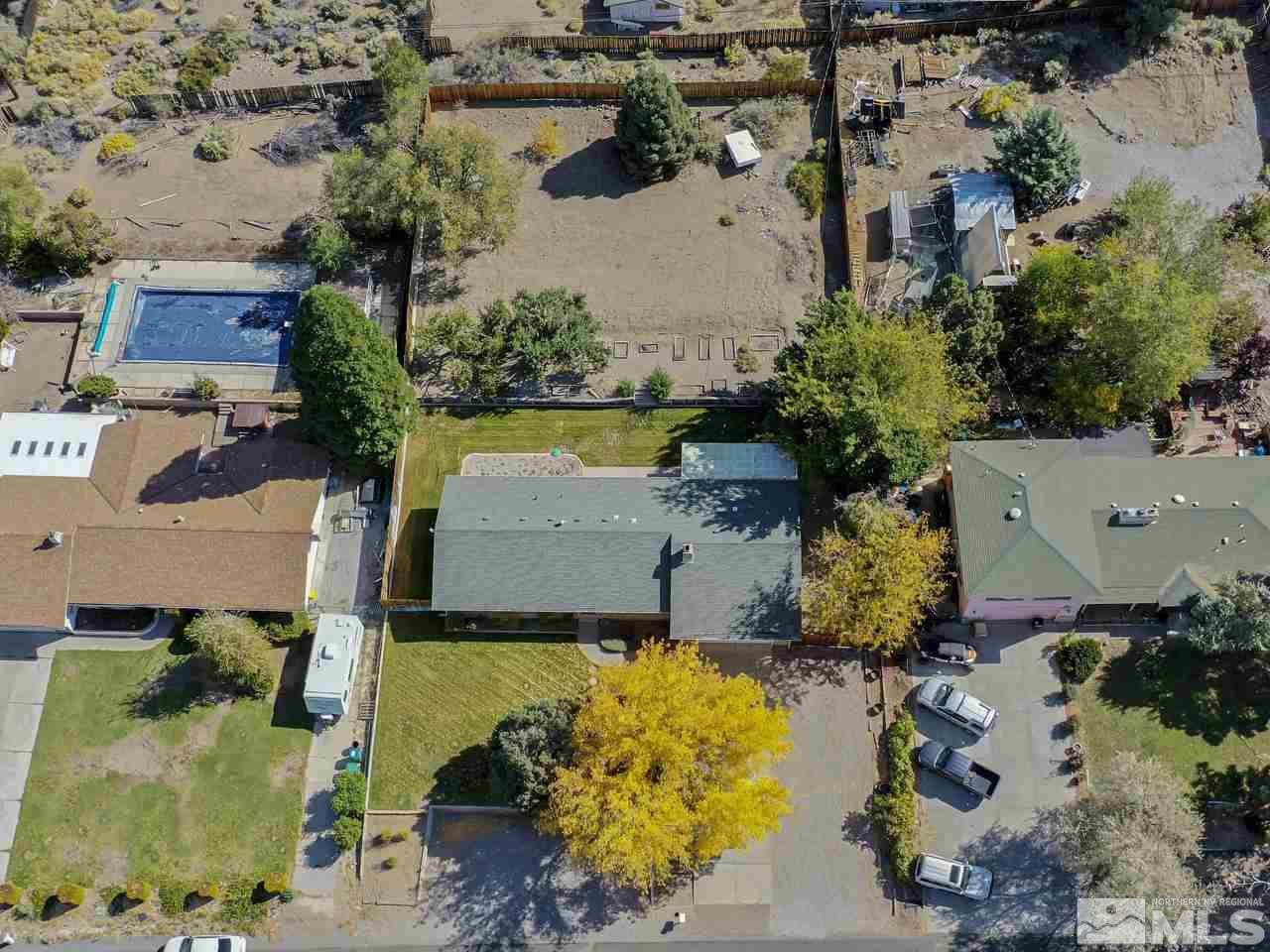 13870 Chamy Drive Reno, NV 89521 - Photo 13 of 21 an aerial view of a house with a yard and a large pool