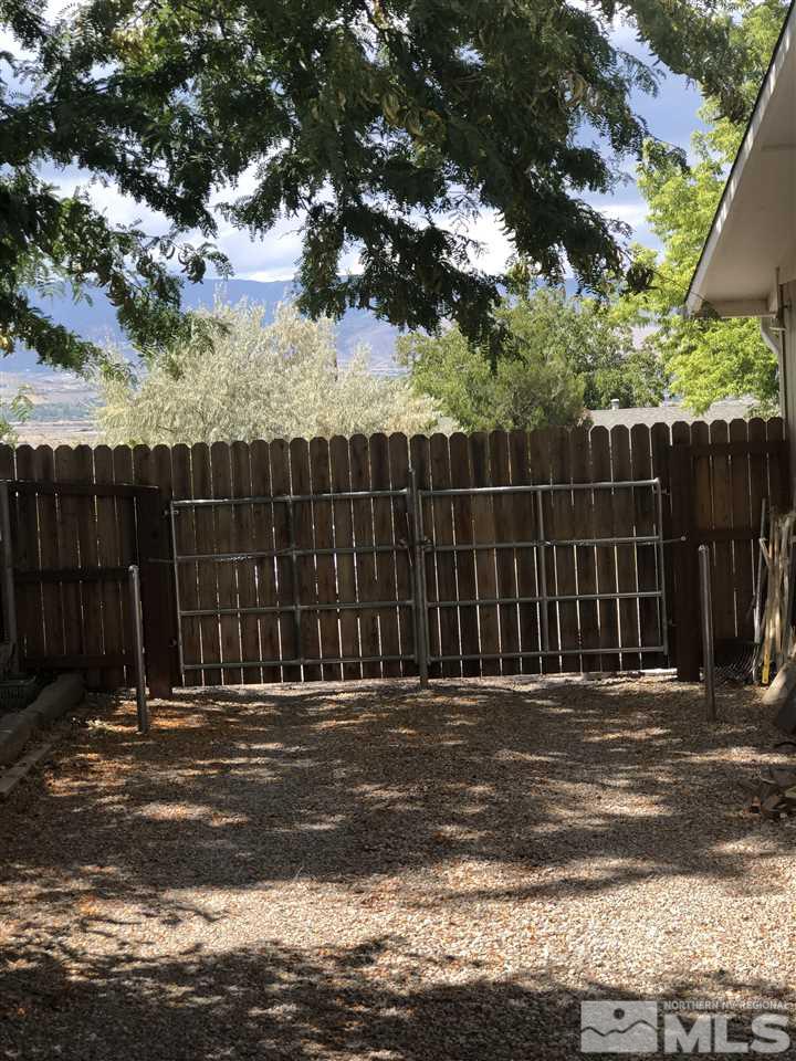 13870 Chamy Drive Reno, NV 89521 - Photo 18 of 21 a view of a wooden fence
