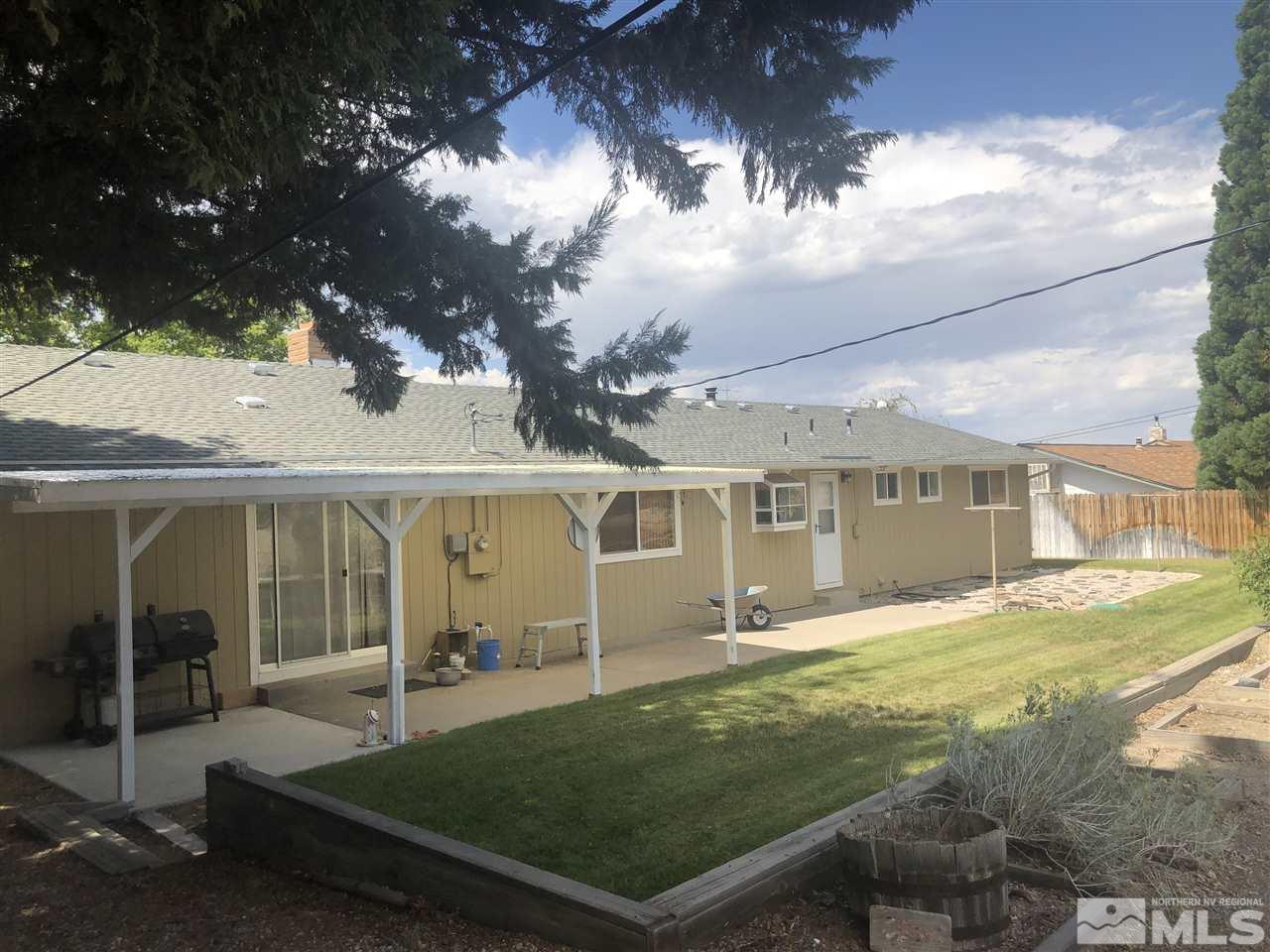 13870 Chamy Drive Reno, NV 89521 - Photo 21 of 21 front view of a house with a yard