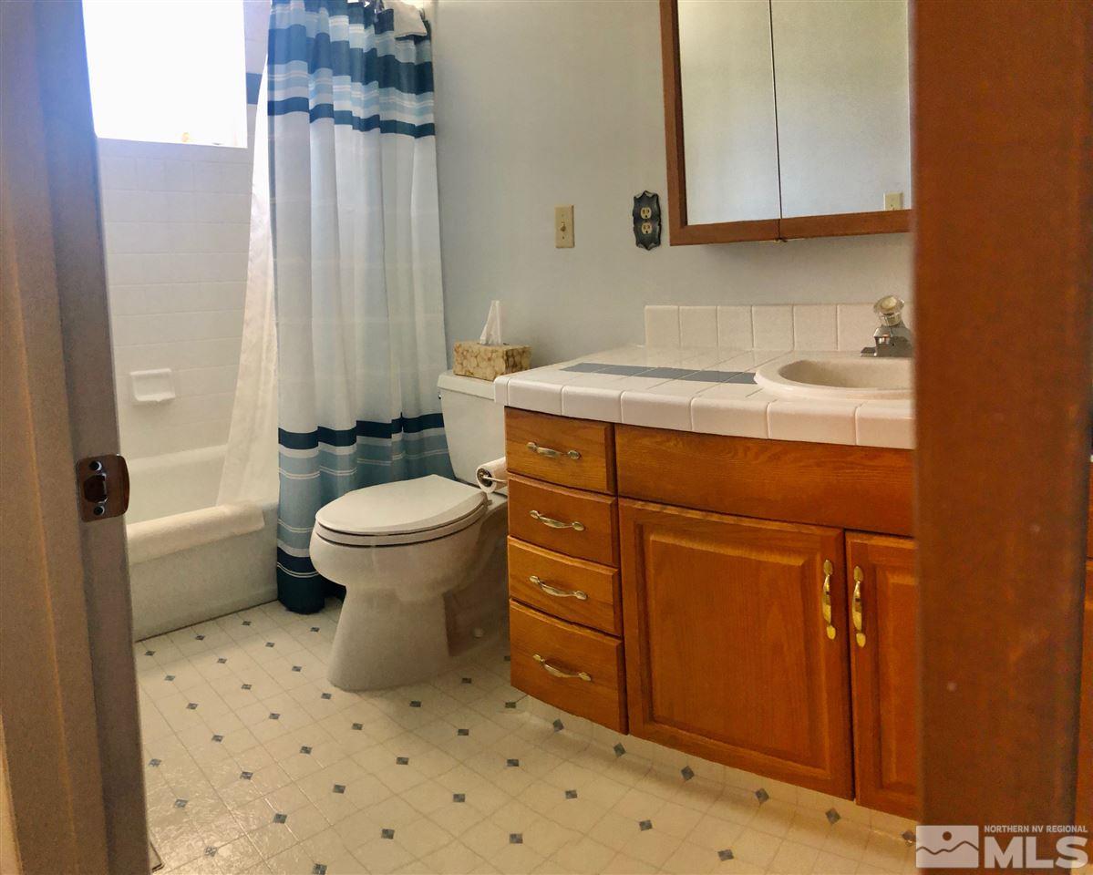 13870 Chamy Drive Reno, NV 89521 - Photo 10 of 21 a bathroom with a sink toilet and shower