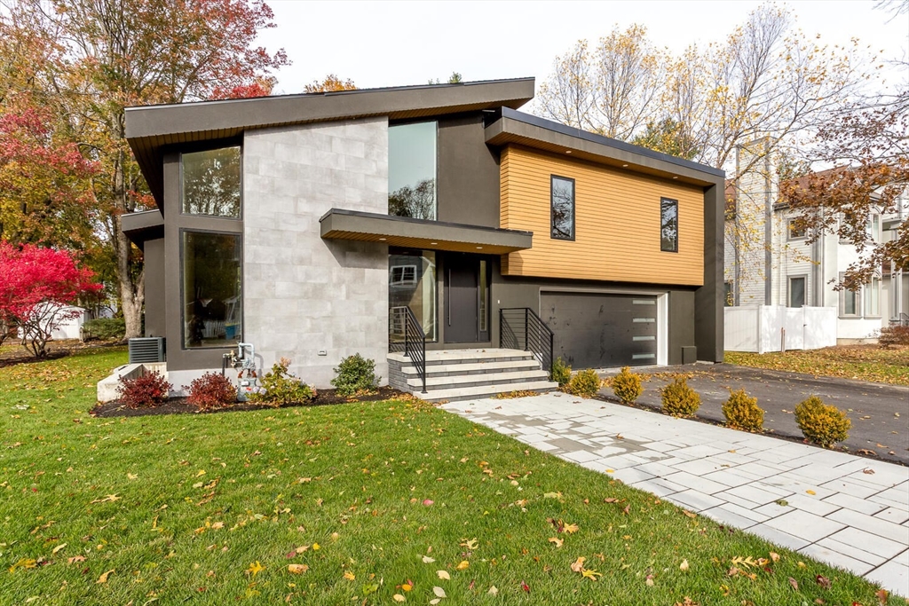 a front view of a house with a yard