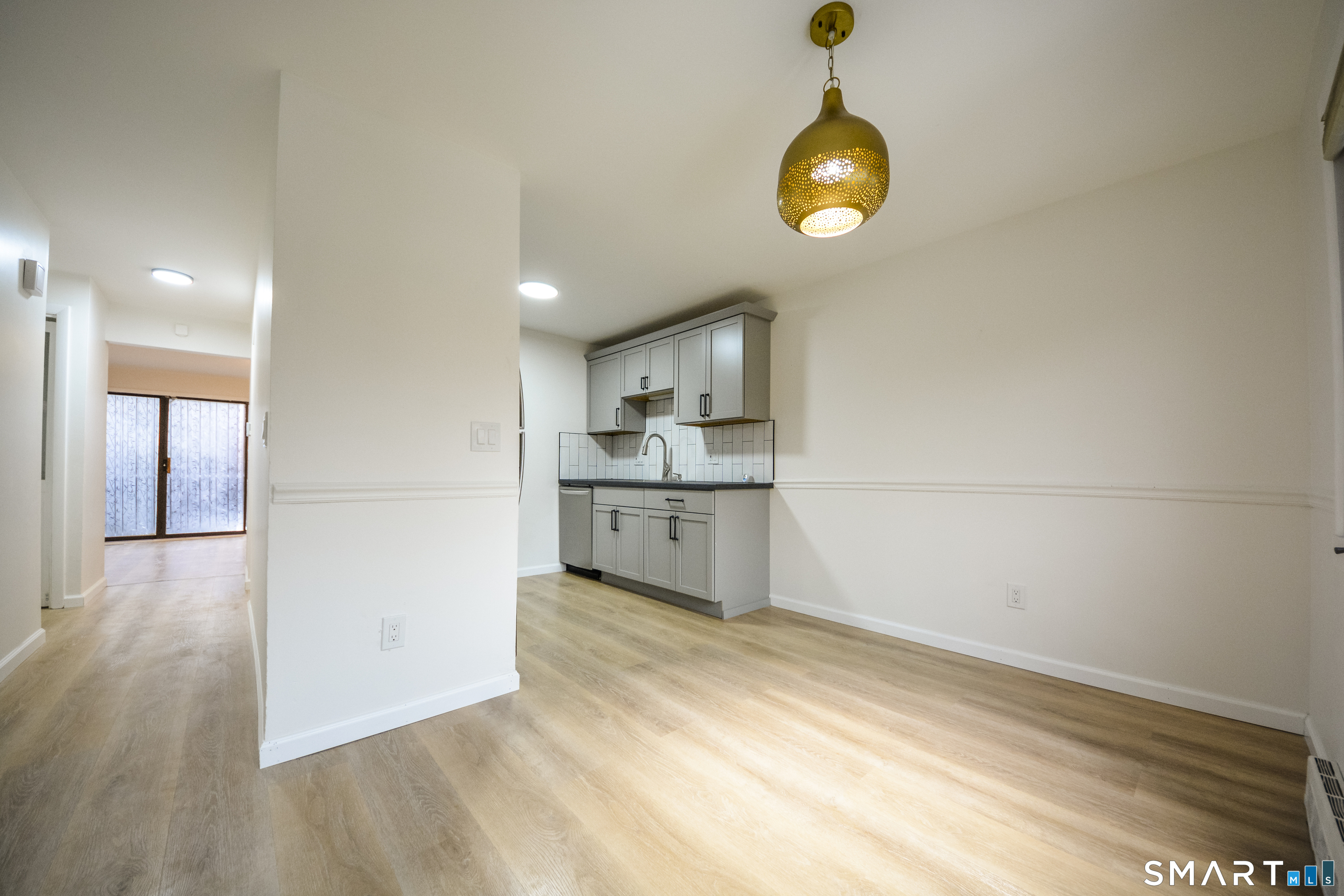 32 Towne House Road, Unit 32 Hamden, CT 06514 - Photo 13 of 35 a view of a kitchen cabinets and wooden floor