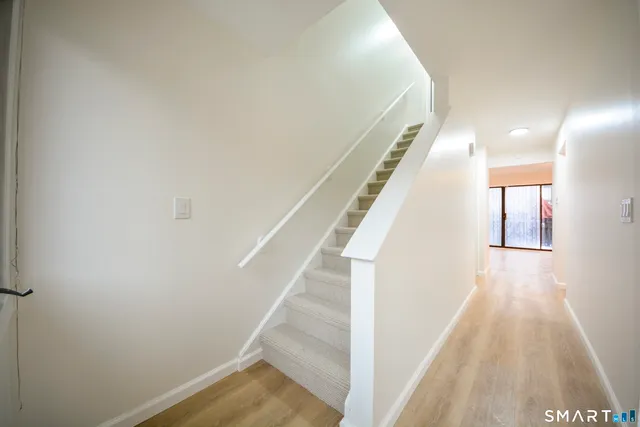 a view of a hallway with staircase