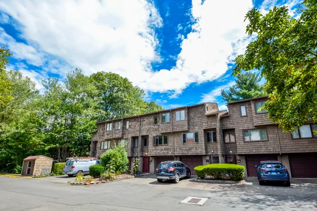 a red and white building with trees in front of it