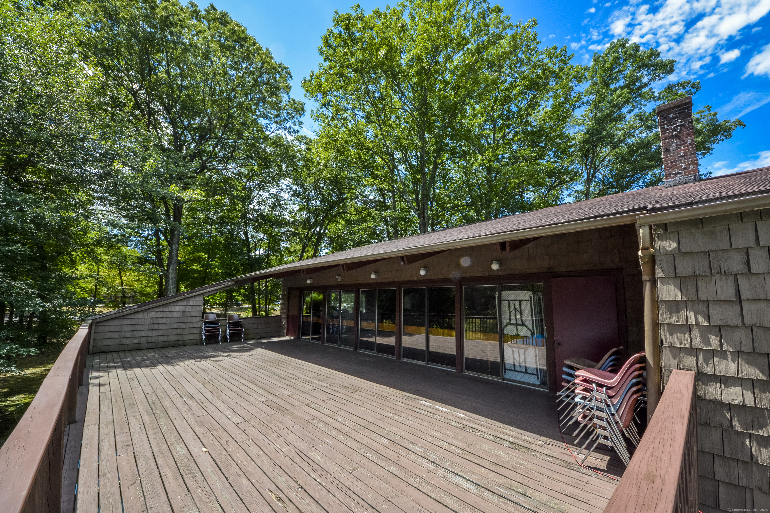 32 Towne House Road, Unit 32 Hamden, CT 06514 - Photo 34 of 35 a balcony with furniture and wooden floor