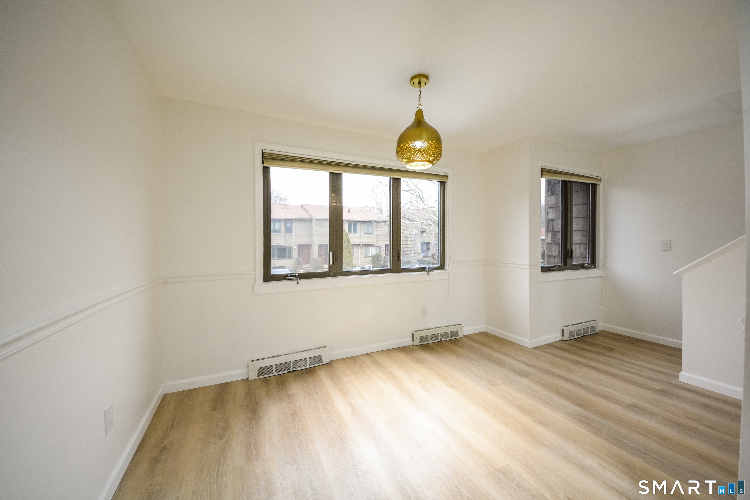 32 Towne House Road, Unit 32 Hamden, CT 06514 - Photo 4 of 35 a view of an empty room and window