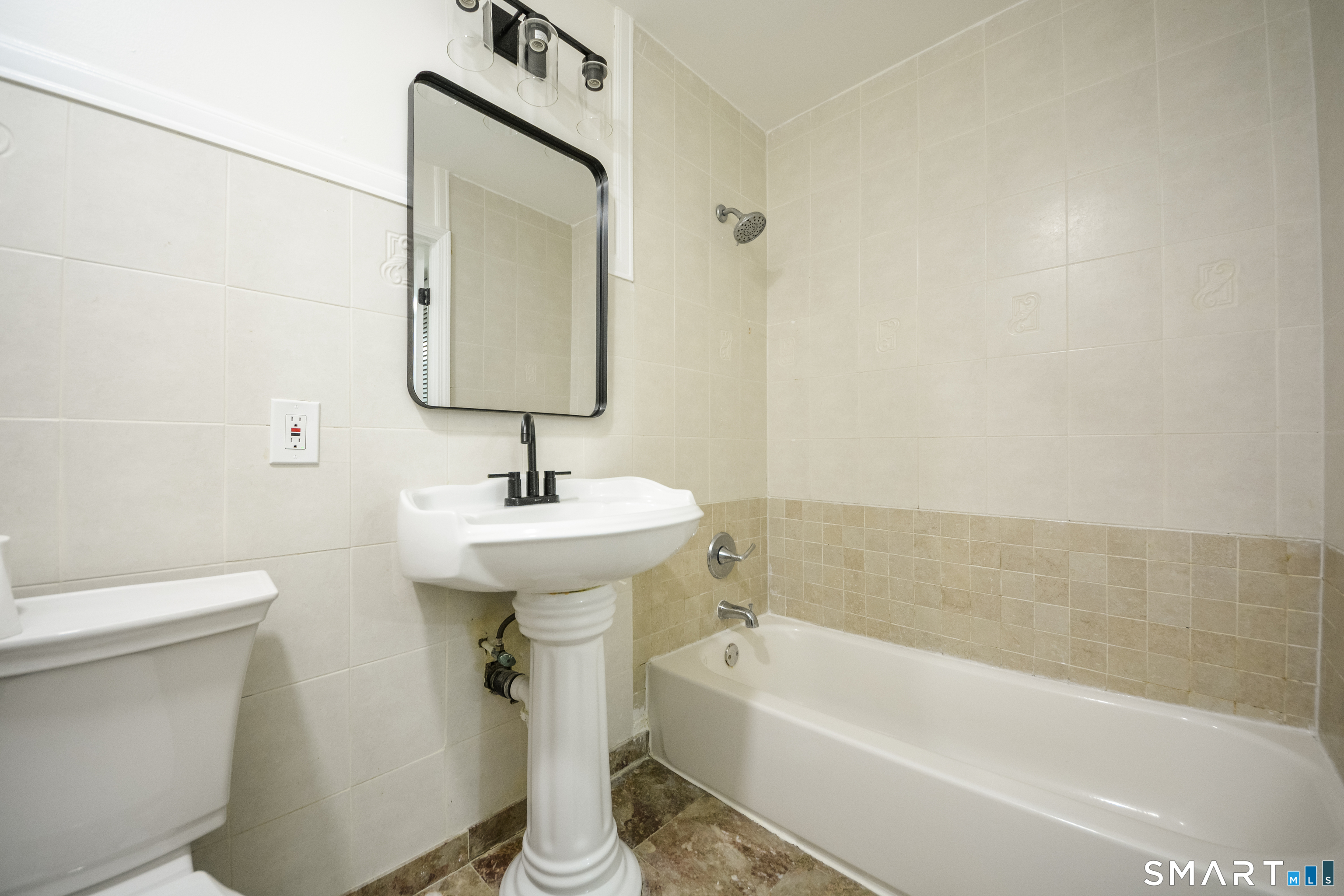 32 Towne House Road, Unit 32 Hamden, CT 06514 - Photo 5 of 35 a bathroom with a sink a toilet and bathtub