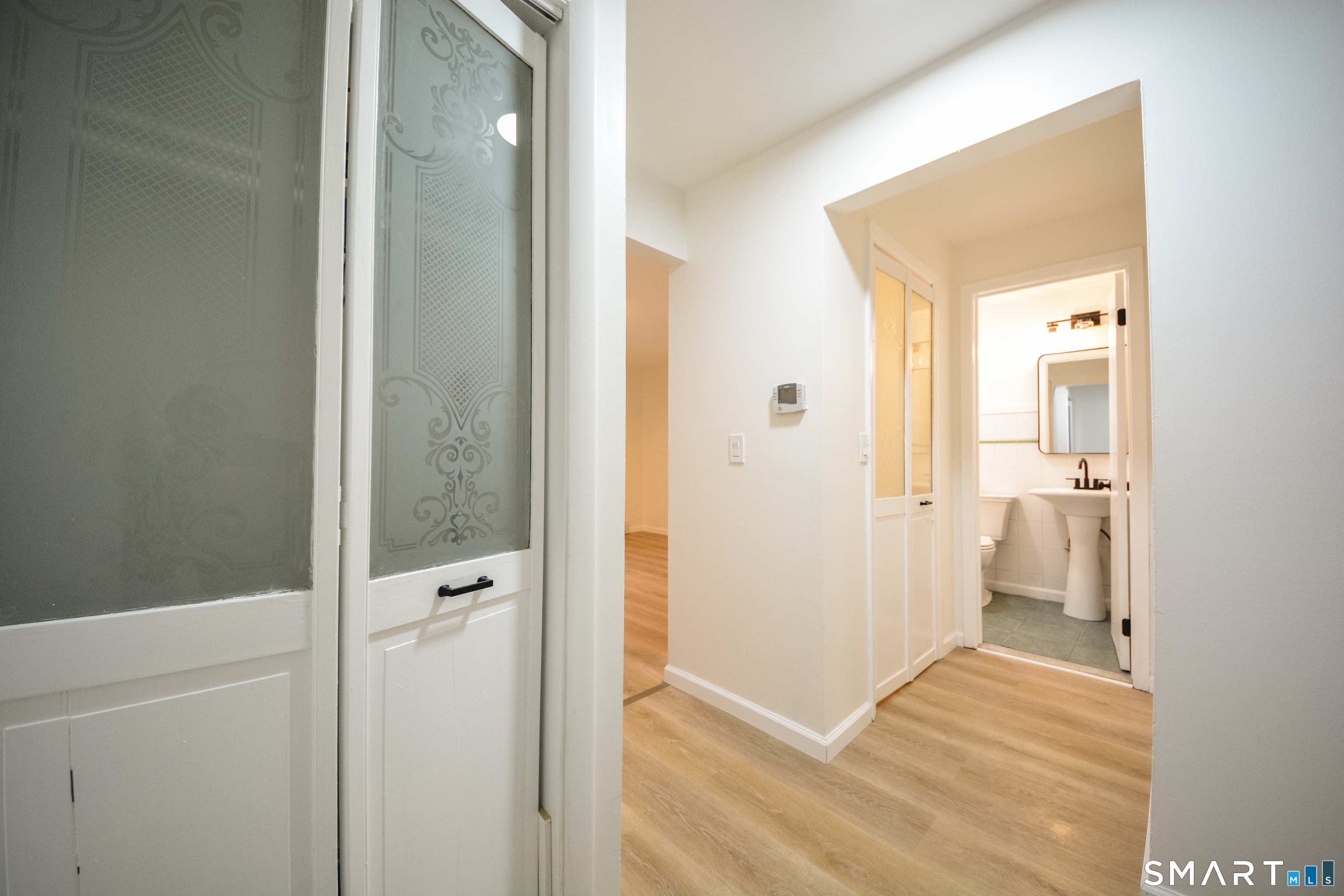 32 Towne House Road, Unit 32 Hamden, CT 06514 - Photo 6 of 35 a view of a bathroom from a hallway