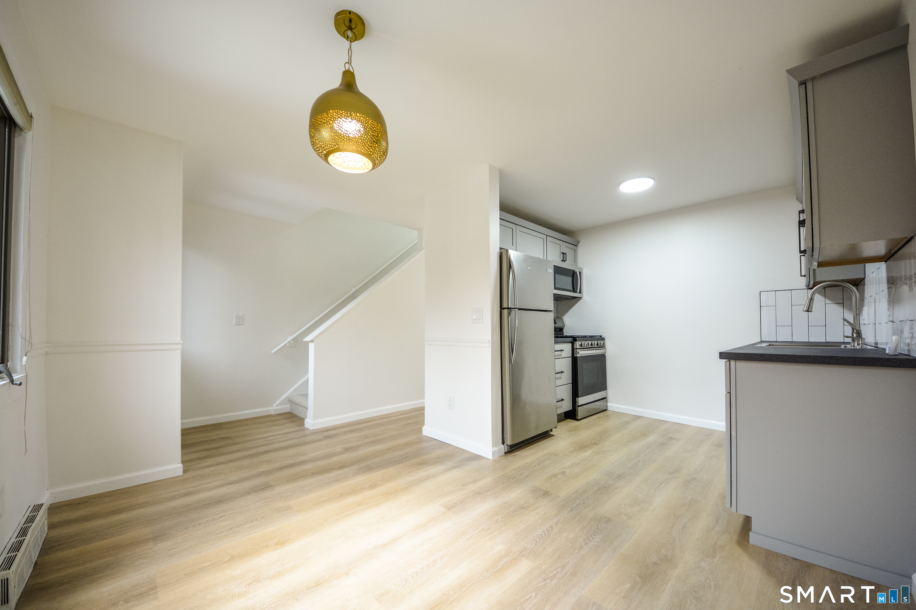 32 Towne House Road, Unit 32 Hamden, CT 06514 - Photo 10 of 35 a view of a kitchen with a sink and a window