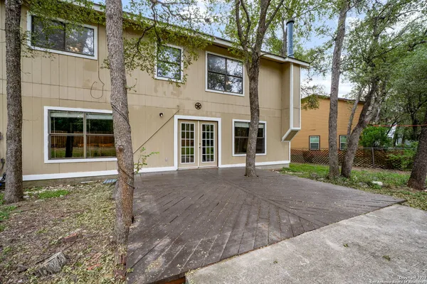 a house with trees in front of it