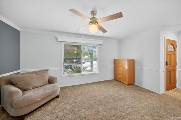 a living room with furniture and a window